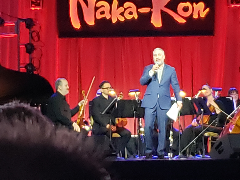 Eric Roth addresses the audience during the Open World concert.